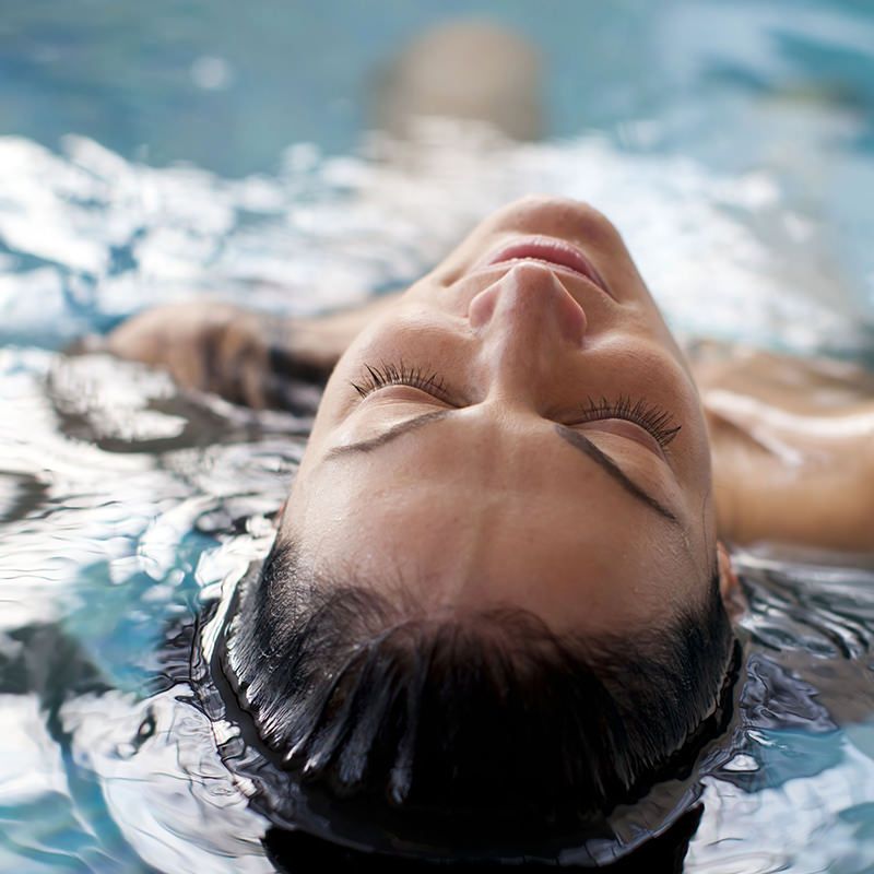 Person Laying in a Pool